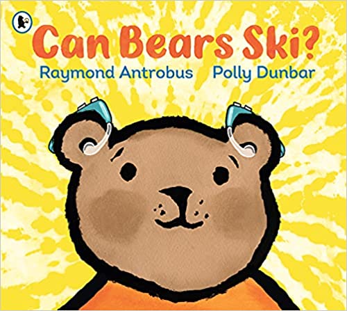 The cover of the book "Can Bears Ski?" features a bright yellow background with the title and the author's name, Raymond Antrobus, at the top. Below is an illustrated smiling brown bear with an orange shirt and two blue hearing aids.