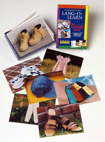 Multi-color box of cards with the text "LANG-O-LEARN" and 7+ cards of photos of real clothing items displayed on a white background. 