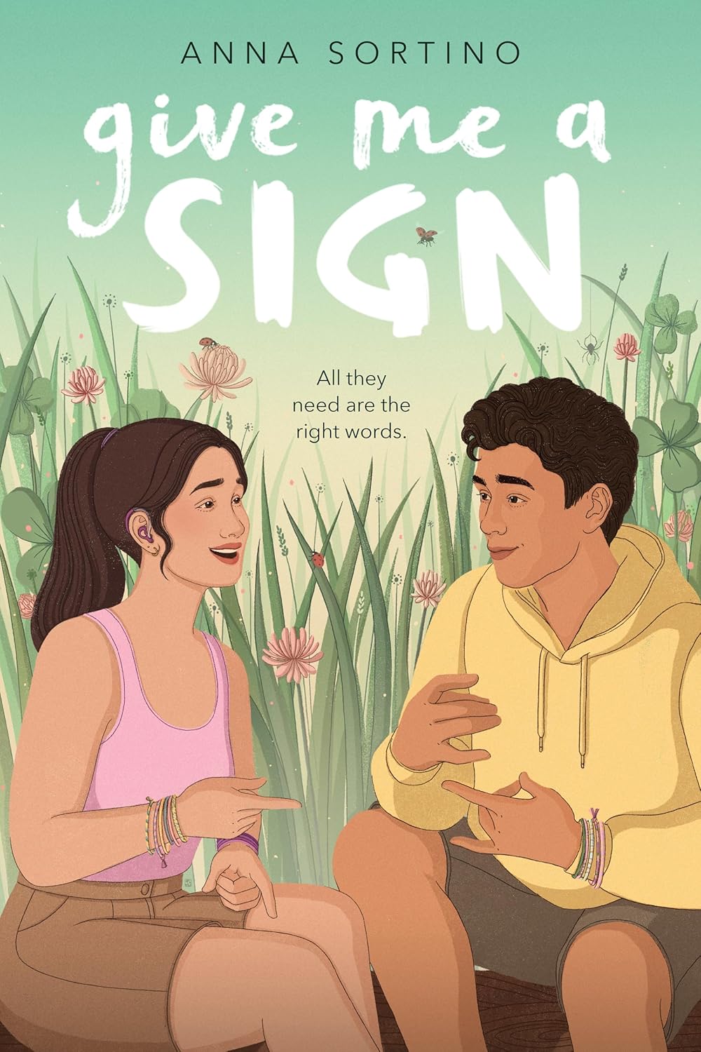 The cover of the book "Give Me a Sign" features an illustrated image of a teenage girl and boy smiling at one another using sign language to communicate sitting in an outdoor setting.