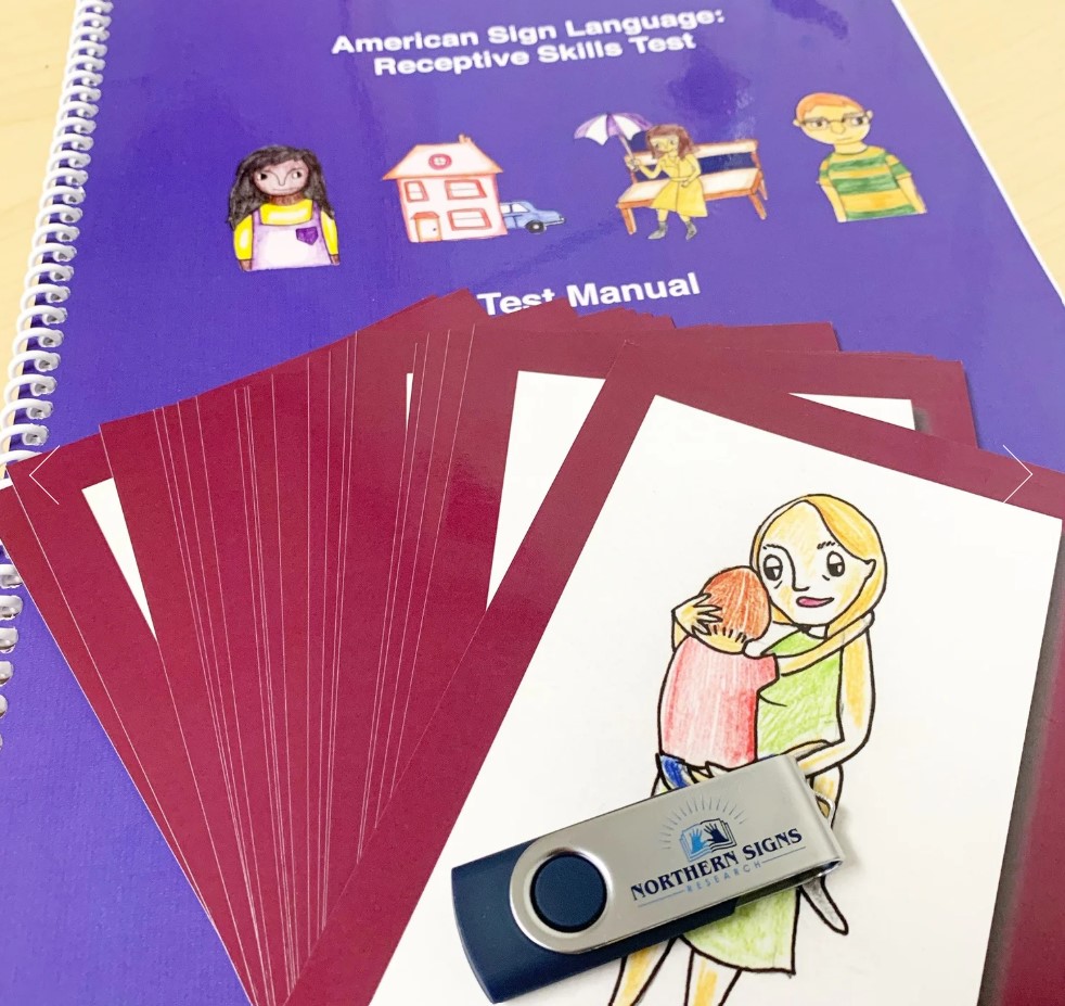 Purple colored book with flashcards setting on top of book