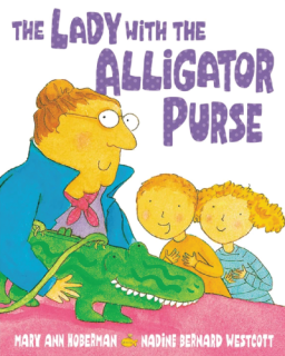 A woman showing her alligator purse to two children
