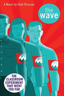Three students with a red arm band with the symbol of a wave on it. 