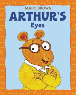 Arthur wearing glasses and sweater. 