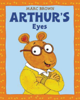Arthur wearing glasses and sweater.