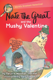 Nate wears a trench coat and deer stalker cap. He is standing behind a dog house with a sleeping dog inside.