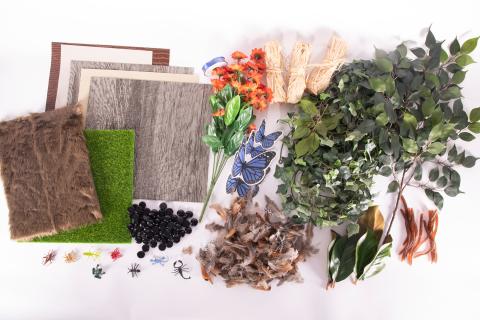 Picture of tactile items and textures. Items like artificial greenery, flowers, butterflies, moss, etc.