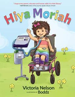 A girl in a wheel char wearing a rainbow striped dress