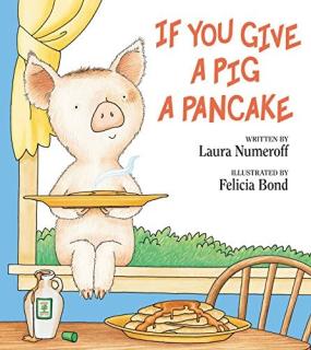 A cartoon pig holding a plate of pancakes