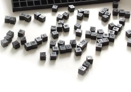 Picture of small, black cubes. 