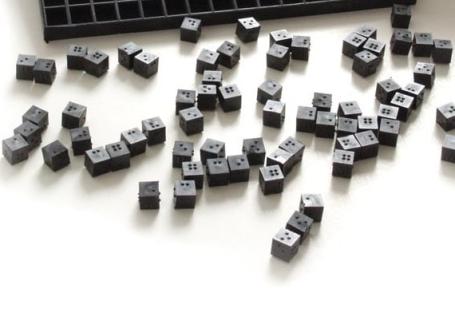 Picture of small, black cubes.