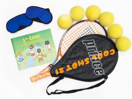 Picture of tennis rackets, balls and guidebook. 