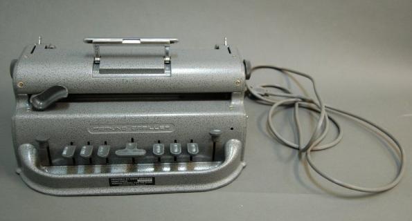 Picture of electric brailler with cord. 