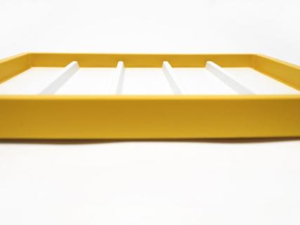 Picture of yellow tray with dividers. 