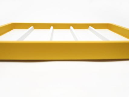 Picture of yellow tray with dividers.
