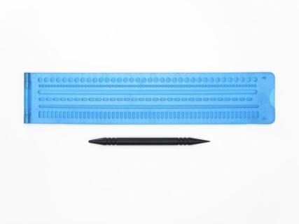 Picture of tactile graphic line slate and stylus.