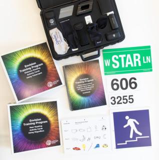 Picture of Envision Kit with optical aids open case.