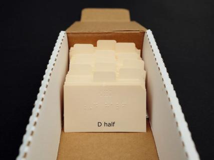 Music braille flash cards in storage box.