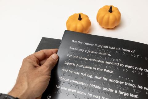 The Littlest Pumpkin hand turning page