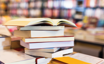 books stacked on a desk