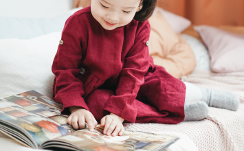 Small child reading a book